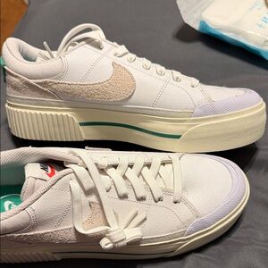 Nike White and Cream Athletic Shoes